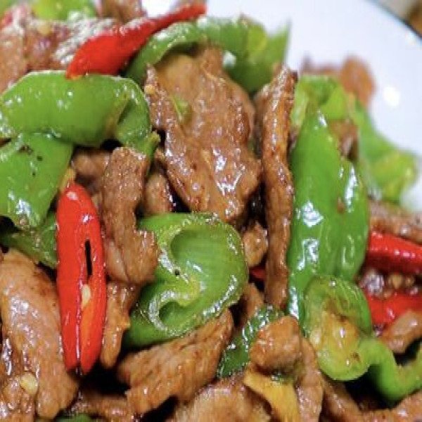 MANZO CON PEPERONI E CIPOLLE IN PADELLA DI FUOCO